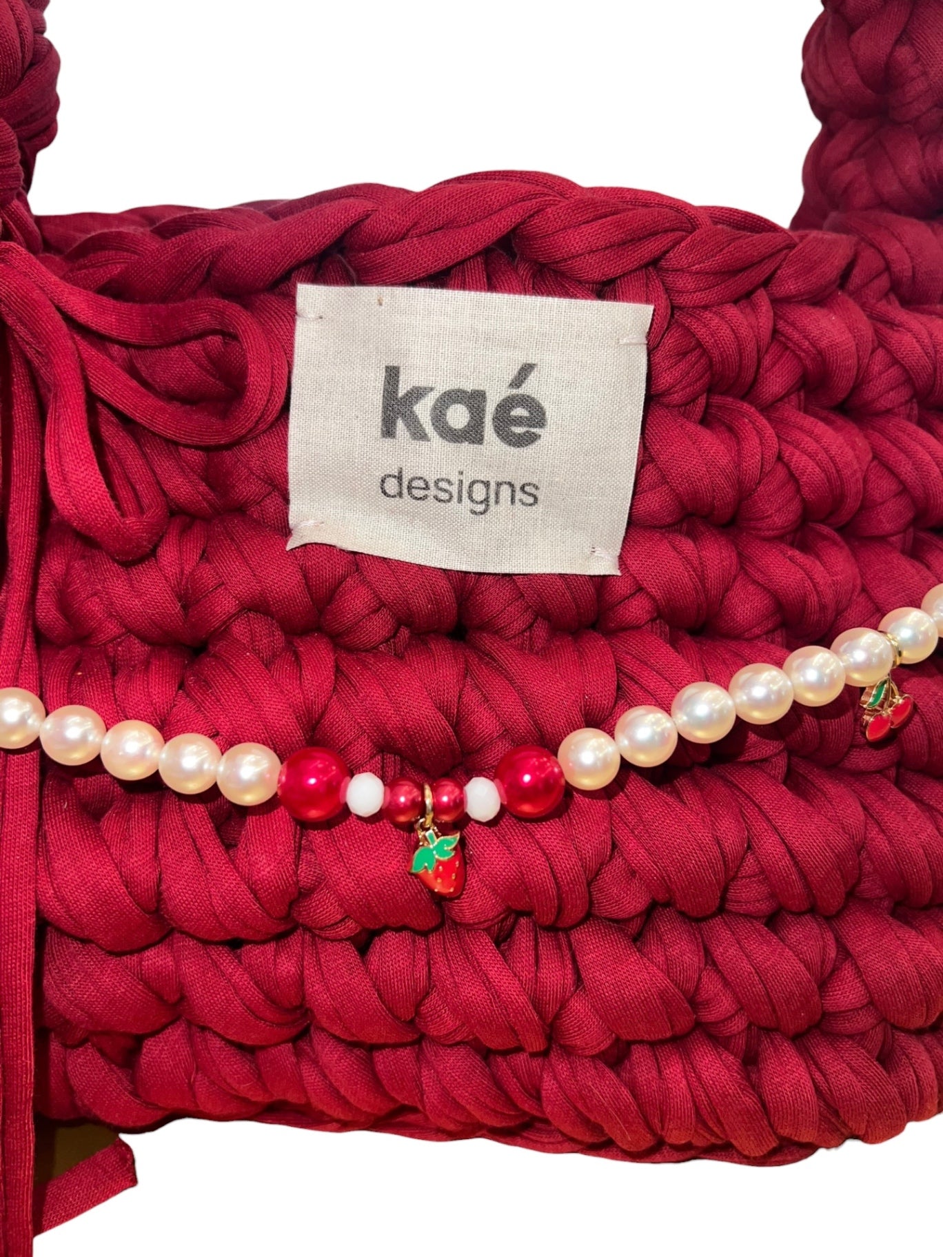 kaé designs Tasche mit Echtperlen-Kette