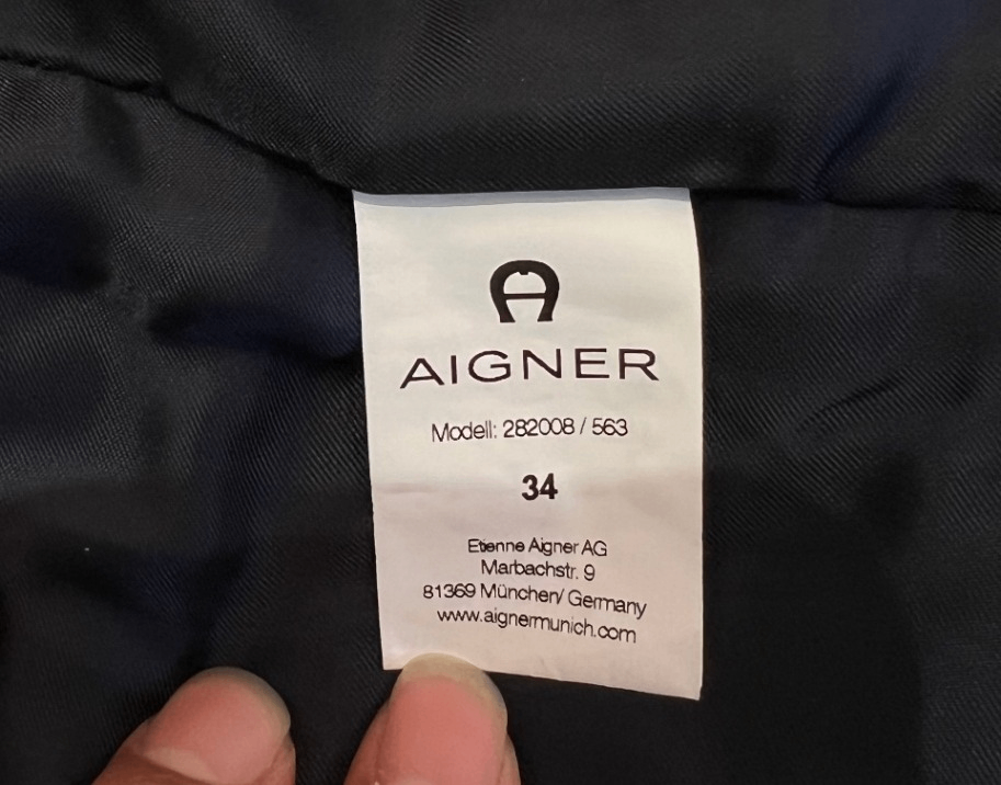 Pre-Loved Aigner Lammfellmantel mit Lederärmeln und Lammfellkragen